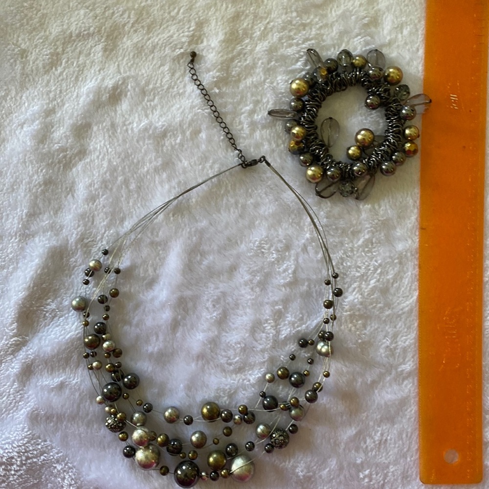 Gray, silver and gold tone necklace and bracelet set.